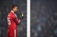 Akinfeev hit by flare in first minute of Montenegro v Russia