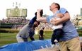 Dad of the year makes one-handed baseball catch while feeding his baby (Gif)