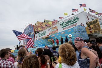 Hot dog eating champion loses title after gut-busting effort