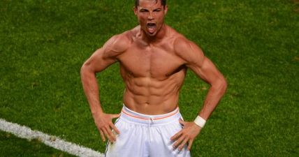 Cristiano Ronaldo shows his son how to flex those six-pack abs in this great family shot