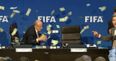 Comedian interrupts FIFA press conference by throwing money at Sepp Blatter