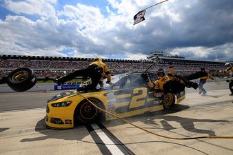 Watch as NASCAR driver crashes into his pit crew (Video)