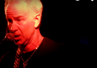 John McEnroe performs Nirvana to a real audience, no really