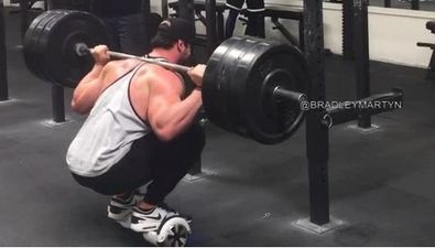 Bradley Martyn squats 140kg on a mini segway (Video)