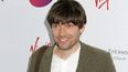 Blur’s Alex James proves all is forgiven by playing Oasis’ ‘Wonderwall’ (Video)