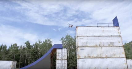 BMX junkie creates huge skatepark out of shipping containers…then backflips off the top (Video)