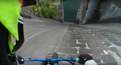 GoPro captures the moment a man mountain biked down a dam (Video)