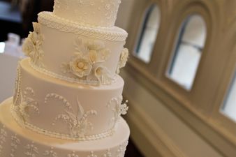 Watch these waiters scare a bride on her wedding day with devious cake prank