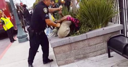 This teenager was arrested by NINE police officers for walking in a bus lane (Video)