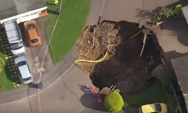 A sinkhole has opened up in the middle of a street in the UK