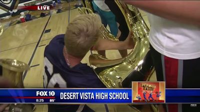 Watch this TV presenter drop his microphone into a tuba in the middle of a live broadcast