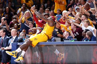 LeBron James stops in the middle of a game to take a selfie with some fans