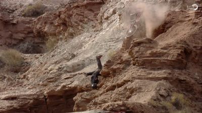 Not even falling off a cliff could stop this biker from completing an extreme course (Video)