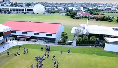 Kid knocks drone from the skies with a football (Video)