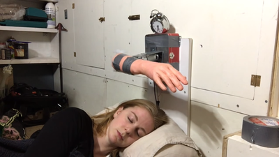 Never oversleep again thanks to an alarm clock that slaps you in the face repeatedly (Video)