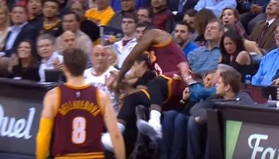 Watch LeBron James flatten the wife of golfer Jason Day during NBA match