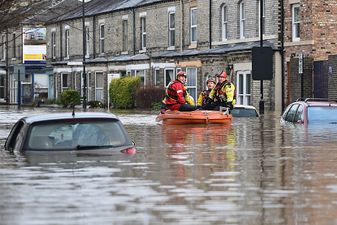 Flood victims slapped with parking tickets and battling bogus callers