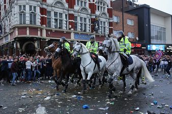 Two West Ham fans saved a mum and her son after yobs smashed up the Manchester United team bus