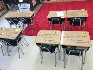 This teacher writes inspirational messages on students’ desks on exam day