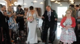 Paralysed father uses robotic suit to walk daughter down the aisle