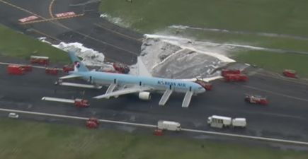 Over 300 passengers and crew evacuated after plane catches fire on Tokyo runway