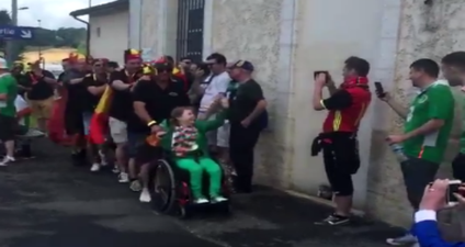 These Belgian fans share a lovely moment with young Ireland fan in wheelchair