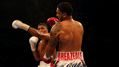 Anthony Joshua knocks out Dominic Breazeale in the seventh round of brutal bout