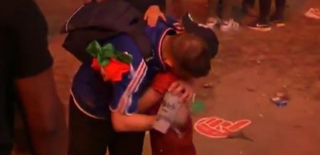 Young Portugal fan consoling a distraught France supporter might make your heart melt