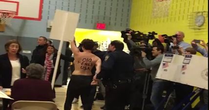 Topless protesters removed from polling station where Donald Trump is due to vote