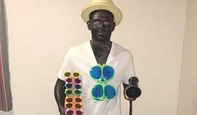 Footballer apologises for painting himself black for Christmas party