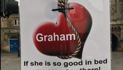 A love-scorned woman has erected these brutal posters about her ex all over town