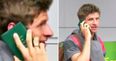 Thomas Müller avoids questions from the press by using his passport as a phone