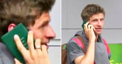 Thomas Müller avoids questions from the press by using his passport as a phone