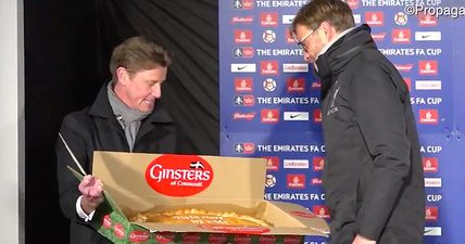 Jurgen Klopp looks utterly bemused as he is presented with giant Ginsters pasty after Cup win