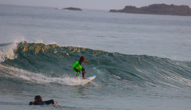 People think they’ve spotted something not quite right with photo of a boy surfing over a shark