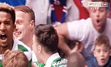 WATCH: Disgusting scenes at Old Firm as Rangers fan seems to make racist monkey gesture to Scott Sinclair