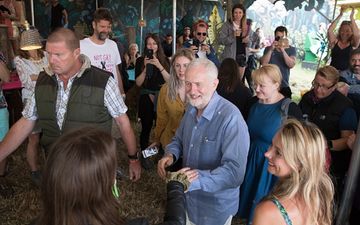 Jeremy Corbyn is actually pulling pints at Glastonbury