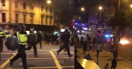 Fireworks and bottles thrown at riot police at Rashan Charles death protest