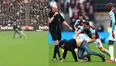 WATCH: Joe Hart has to restrain Mark Noble as he throws pitch invader to the floor