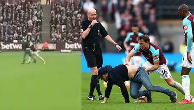 WATCH: Joe Hart has to restrain Mark Noble as he throws pitch invader to the floor