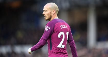 David Silva celebrates winning the title with his baby son