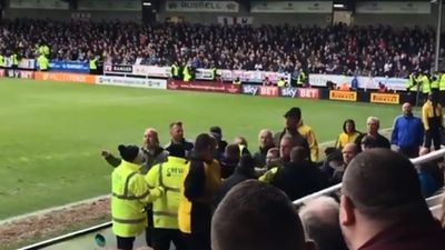 Bolton fans clash with one another and attempt to get at manager in ugly altercation