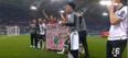 Liverpool players celebrate with Sean Cox banner after Roma match