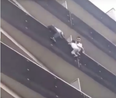 WATCH: Hero climbs up apartment building to save child hanging from balcony