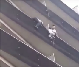 WATCH: Hero climbs up apartment building to save child hanging from balcony