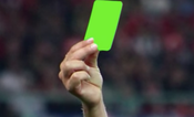 Referee brandishes first ever green card in a football match