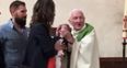 WATCH: Priest loses temper and slaps crying baby during baptismal service