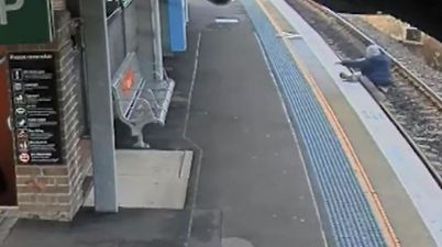 Drunk man is miraculously saved from oncoming train after he fell onto the tracks