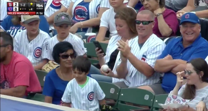 Adult man steals ball from small child at baseball game, but it’s not quite as it seems