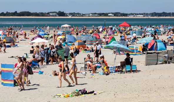 CHICHESTER, ENGLAND - JULY 23: Beachgoers gather on West Wittering Beach during hot weather on the first day of the Summer school holidays on July 23, 2018 in Chichester, England. Today has been the hottest day of 2018 with temperatures rising to 33.3 degrees celsius in some areas. The Met Office have issued an amber weather warning to stay out of the sun between now and Friday as temperatures could continue to rise to 35 degrees celsius. (Photo by Jack Taylor/Getty Images)